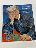 Front cover showing the man resting head on hand in blue-themed post-impressionist art style, titled 'Cezanne to Van Gogh, The Collection of Doctor Gachet' by The Metropolitan Museum of Art.