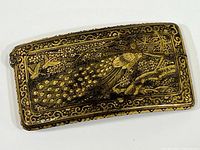 Front view of closed case showing peacock motif and floral border