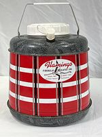 Front view of the insulated jug showcasing its overall design, colors, handle, lid, and spout.