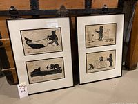 Two black-framed silhouette prints visible in each of two frames showing all four prints in the lot