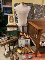 Full lot view with dress form, shoe molds on the floor, sewing basket with magazines, framed artwork, wooden clamp and Capezio taps visible.