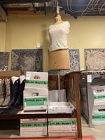 Vintage dress form size 16 with white tank top and boxes of women's 1980s sewing patterns around it.