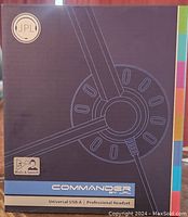 Front of the headset box showing JPL Commander branding and universal USB-A professional headset label.