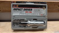 Photo of Performance Tool Impact Driver W2500P 3/8" with 4 bits in original packaging