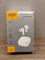Front of the box showing QCY branding, model T13 ANC, image of white earbuds and charging case, noise cancelling feature.