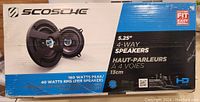 Photo of the Scosche HD5254F speaker box showing 5.25-inch 4-way speakers with 160 watts peak and 40 watts RMS per speaker specifications.