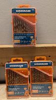 Three packaged Starkmann titanium coated 13-piece drill bit sets with orange and blue plastic cases, stacked vertically.