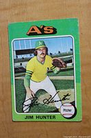 Front of 1975 Topps Jim Hunter baseball card showing player in Oakland A's uniform with team logo and card number.