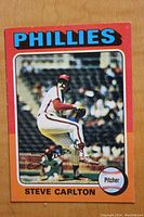 Front of the 1975 Topps Steve Carlton card showing the image of Steve Carlton pitching for the Phillies with clear team and player name.
