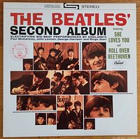 Front cover of The Beatles' Second Album vinyl record showing album title, Capitol Records branding, and collage of band photos.