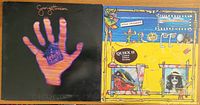 Front covers of two George Harrison vinyl albums side by side: Living in the Material World with a glowing hand image, and Gone Troppo with vibrant yellow abstract artwork.