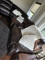 Overall L-shaped configuration in living room showing two reclining ends, corner wedge and middle sections