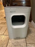 Front view showing entrance opening and exterior housing