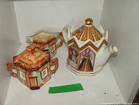 Photo showing cottage ware creamer and sugar set alongside Sadler teapot with King Henry VIII and Six Wives illustrations.