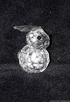 Front and side view of the Swarovski crystal bunny rabbit figurine showing clear faceted crystal and black eyes