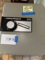 Top view of the safe showing the combination lock and label.