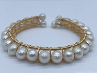 Front close-up of gold plated bracelet featuring 7-8mm round genuine pearls individually wired along the frame.
