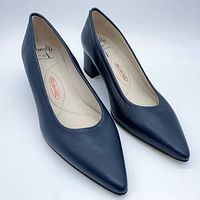 Angled front view of both blue leather pointed-toe pumps showing smooth leather upper and full side profile of heel