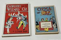 Front covers of both books: Dorothy and the Wizard in Oz with red cover, Ozma of Oz with blue cover featuring characters.