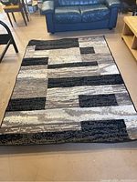 Full view of area rug laid flat showing overall pattern and colors