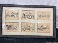 Framed artwork containing six separate ink drawings on beige paper, arranged in two rows of three, showing various village and architectural scenes