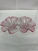 Overhead view of pink divided relish dish showing Rosella floral embossed pattern and ruffled edges