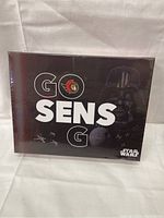Front view of unopened puzzle box featuring Ottawa Senators logo, Star Wars branding, and the text 'GO SENS GO' with Darth Vader image.