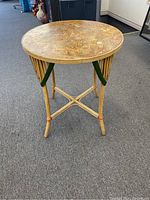 Full view of the vintage bamboo round table showing the bamboo frame and crisscross supports