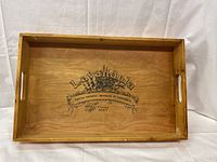 Wooden serving tray with 'Lavandula' printed design inside, showing the full base and cutout handles on shorter sides.