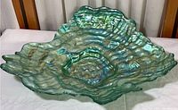 Full view of teal oyster-shaped art glass platter showing size and shape.