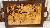 Full view of wooden tray with glass-protected wood etching of a deer in forest landscape, showing entire rectangular tray with handles and carved border.