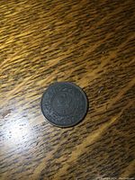 Back side view of the 1864 New Brunswick penny coin, showing the same details with circulation wear and surface texture.