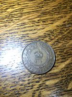 Obverse side of the 1917 Newfoundland penny showing 'ONE CENT 1917 NEWFOUNDLAND' with a crown symbol in the center.