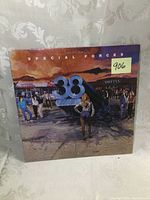 Front cover of 38 Special 'Special Forces' album, showing painted scene and band logo.