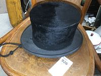 Top view of the antique Superior top hat showing the plush exterior and wide brim.