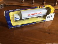 Front view of the boxed Big Rigs Honda truck, showing packaging and truck inside.
