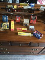 Overview of vintage product boxes and wooden coat rack on dresser
