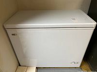 Front view of white Danby Premier chest freezer showing clean exterior and closed lid.