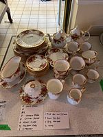 Overview of full Old Country Roses china set including plates, cups, pots and tray