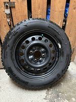 Full side view of tire mounted on steel rim