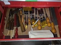Overview of red toolbox drawer containing all tools