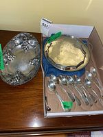 Overview of all pieces including oval tray, round platter, teaspoons and condiment spoon