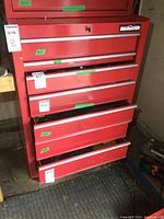 Front view of entire 7-drawer cabinet with some drawers open