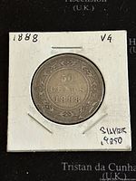 Obverse side of 1888 Newfoundland 50 cents coin showing denomination and year inside floral wreath.