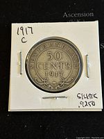 Reverse side of the 1917 Newfoundland 50 cents silver coin showing denomination and year.