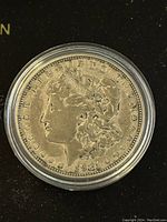 Obverse side of the 1921 Morgan silver dollar showing Lady Liberty profile.