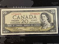 Front of the 1954 Canadian $20 banknote showing Queen Elizabeth II portrait and serial numbers.