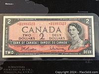 Front view of 1954 Canada two dollar banknote showing Queen Elizabeth II portrait, serial numbers, and bilingual denomination text.