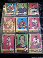 Front view of nine NHL hockey cards from 1972-3 O-Pee-Chee collection showing player portraits, team logos and player names.
