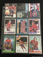 Front view of 9 assorted Montreal Canadiens hockey trading cards in protective sleeve. Shows images of players and team card.